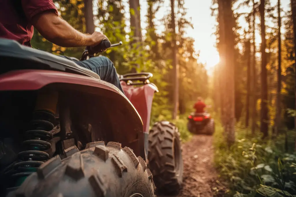 Thrilling atv quad bike adventure in scenic forest trail
